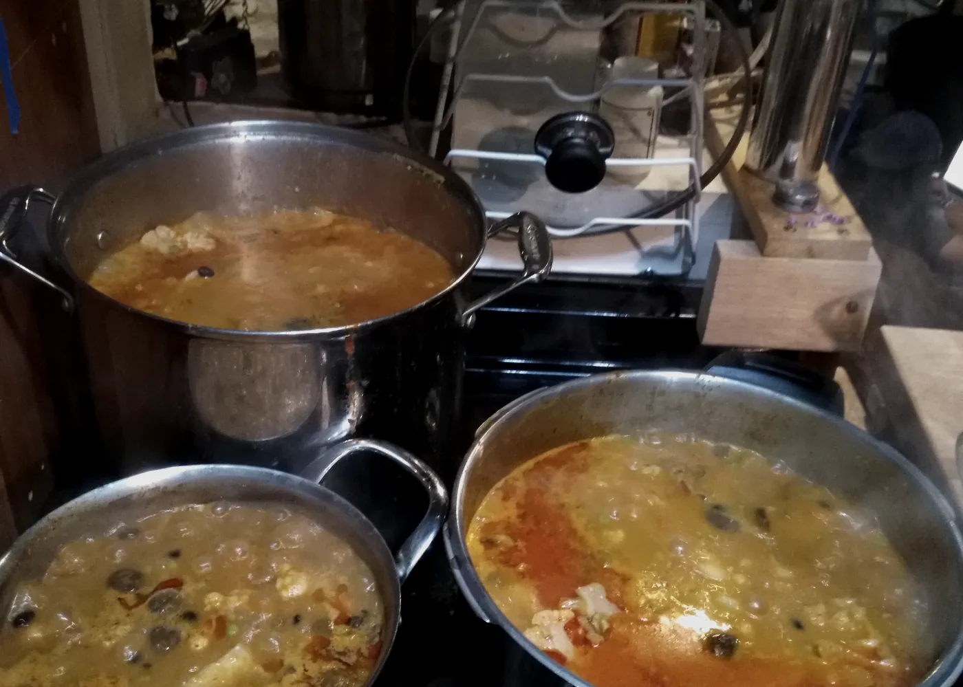 Cooking pots and shared food on a table